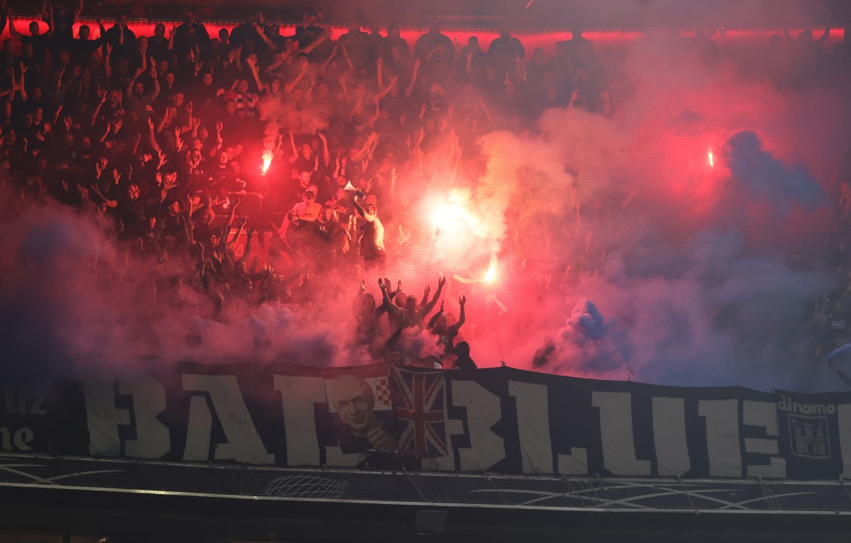 Dinamo Zagreb fans light flares during the UEFA Champions League football match FC Bayern Munich vs GNK Dinamo Zagreb in Munich, southern Germany, on September 17, 2024. (Photo by Alexandra BEIER / AFP)